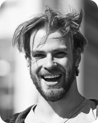 guy with bike happily smiling with white teeth